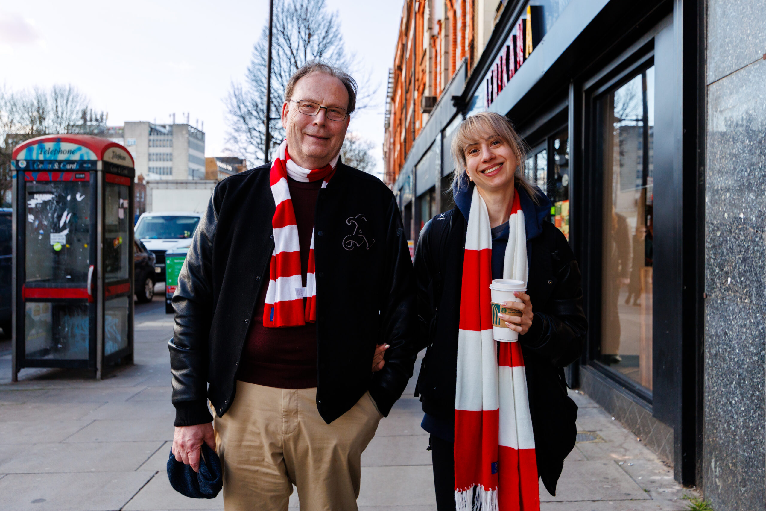 Arsenal fans, a father and daughter with Arsenal scarves on Holloway Road.